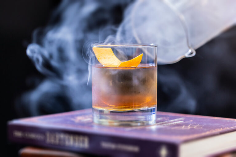 cocktail with smoke and books