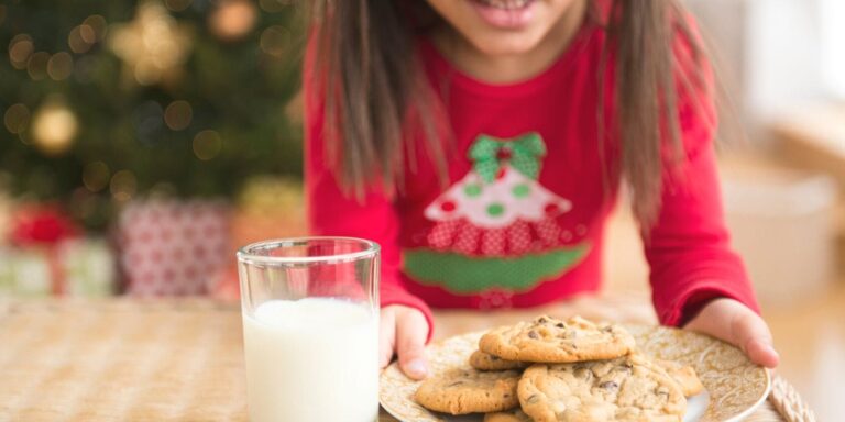 girl leaves milk for santa